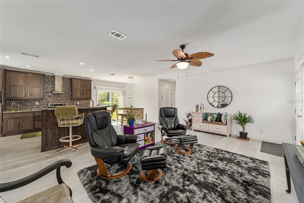 4520 Northwest 95th Avenue Road Ocala, FL 34482 - Photo 20 of 87 a living room with lots of furniture and a clock