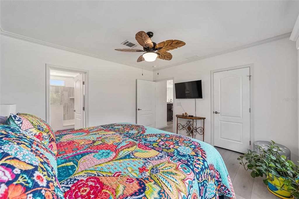 4520 Northwest 95th Avenue Road Ocala, FL 34482 - Photo 27 of 87 a bedroom with a bed and a flat tv screen on dresser