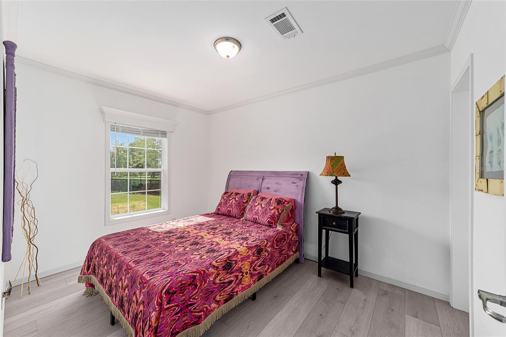 4520 Northwest 95th Avenue Road Ocala, FL 34482 - Photo 31 of 87 a bedroom with a bed and window