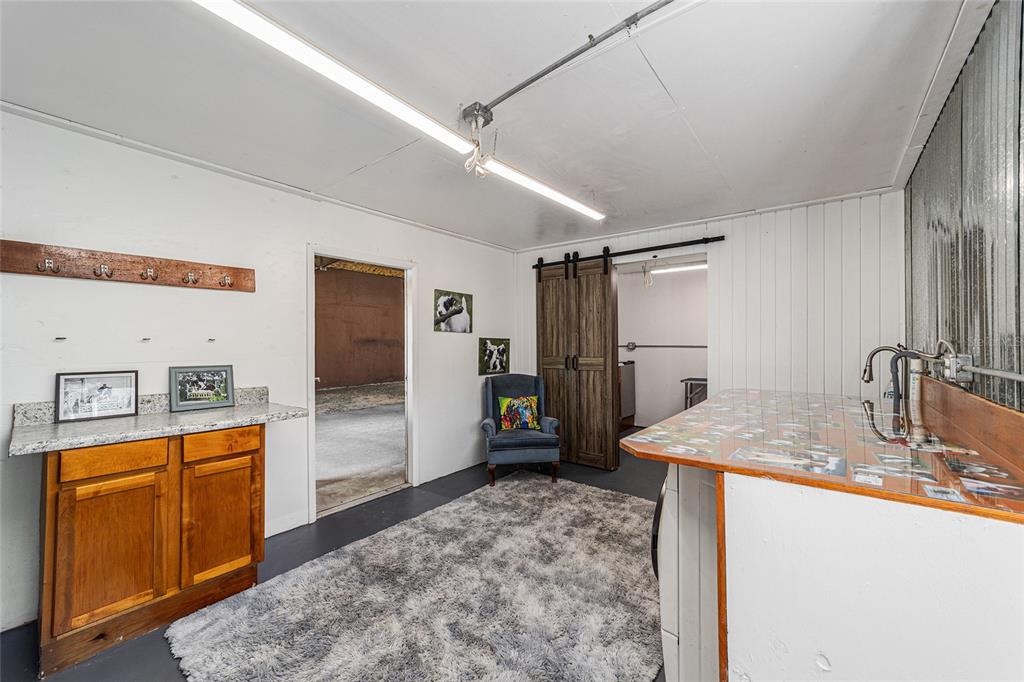 4520 Northwest 95th Avenue Road Ocala, FL 34482 - Photo 41 of 87 a kitchen with sink a refrigerator and wooden cabinets