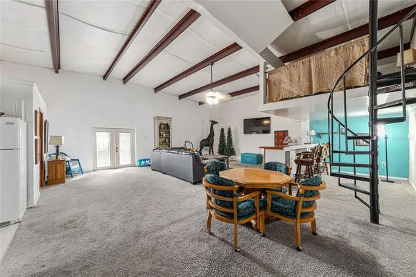a room with table and white walls