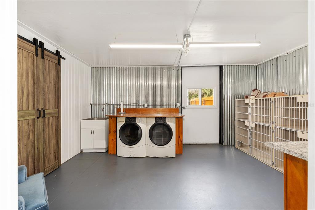 4520 Northwest 95th Avenue Road Ocala, FL 34482 - Photo 69 of 87 a utility room with refrigerator and washer