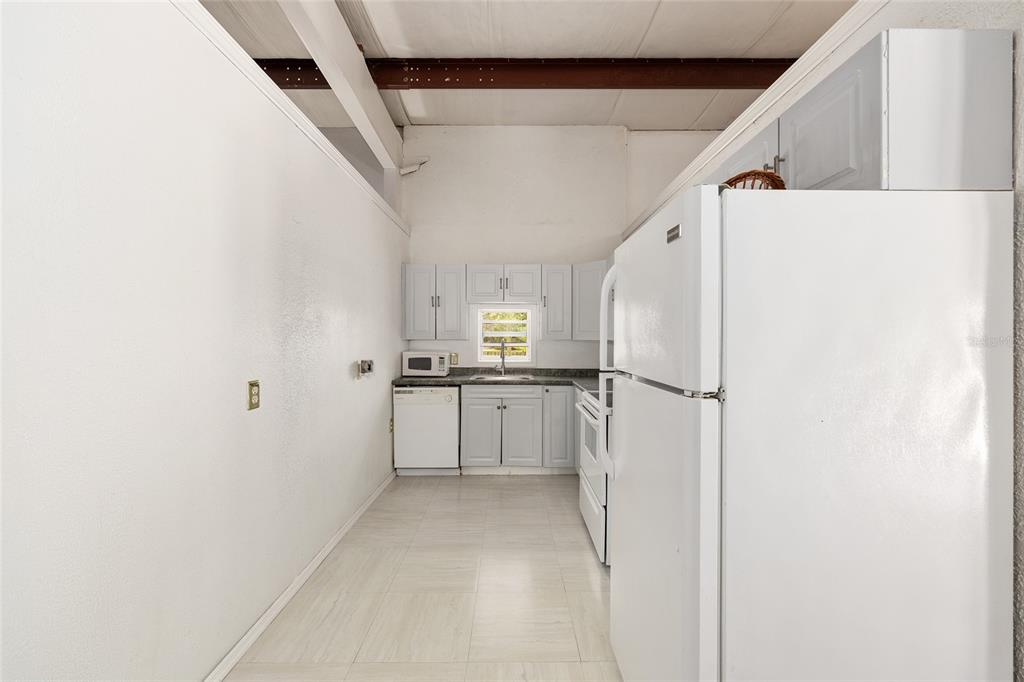 4520 Northwest 95th Avenue Road Ocala, FL 34482 - Photo 76 of 87 a view of kitchen with furniture and refrigerator