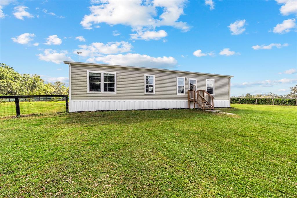 4520 Northwest 95th Avenue Road Ocala, FL 34482 - Photo 8 of 87 a view of a house with a backyard