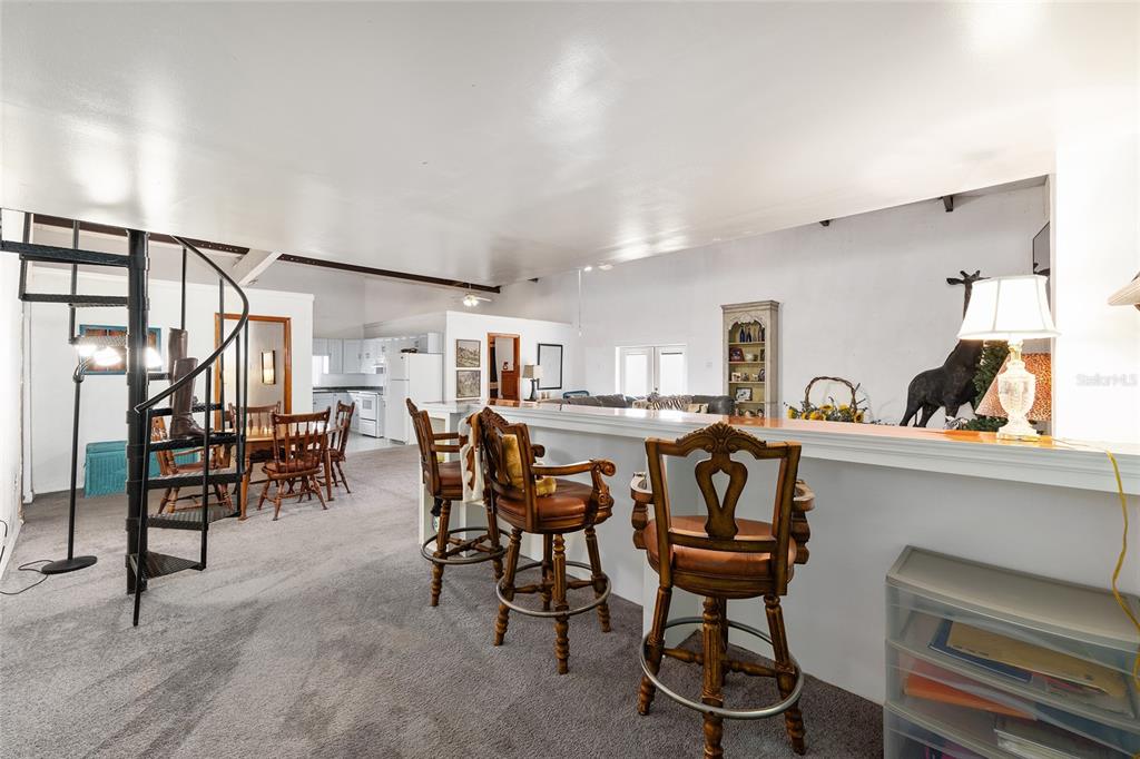 4520 Northwest 95th Avenue Road Ocala, FL 34482 - Photo 82 of 87 a view of a dining room with furniture and a chandelier