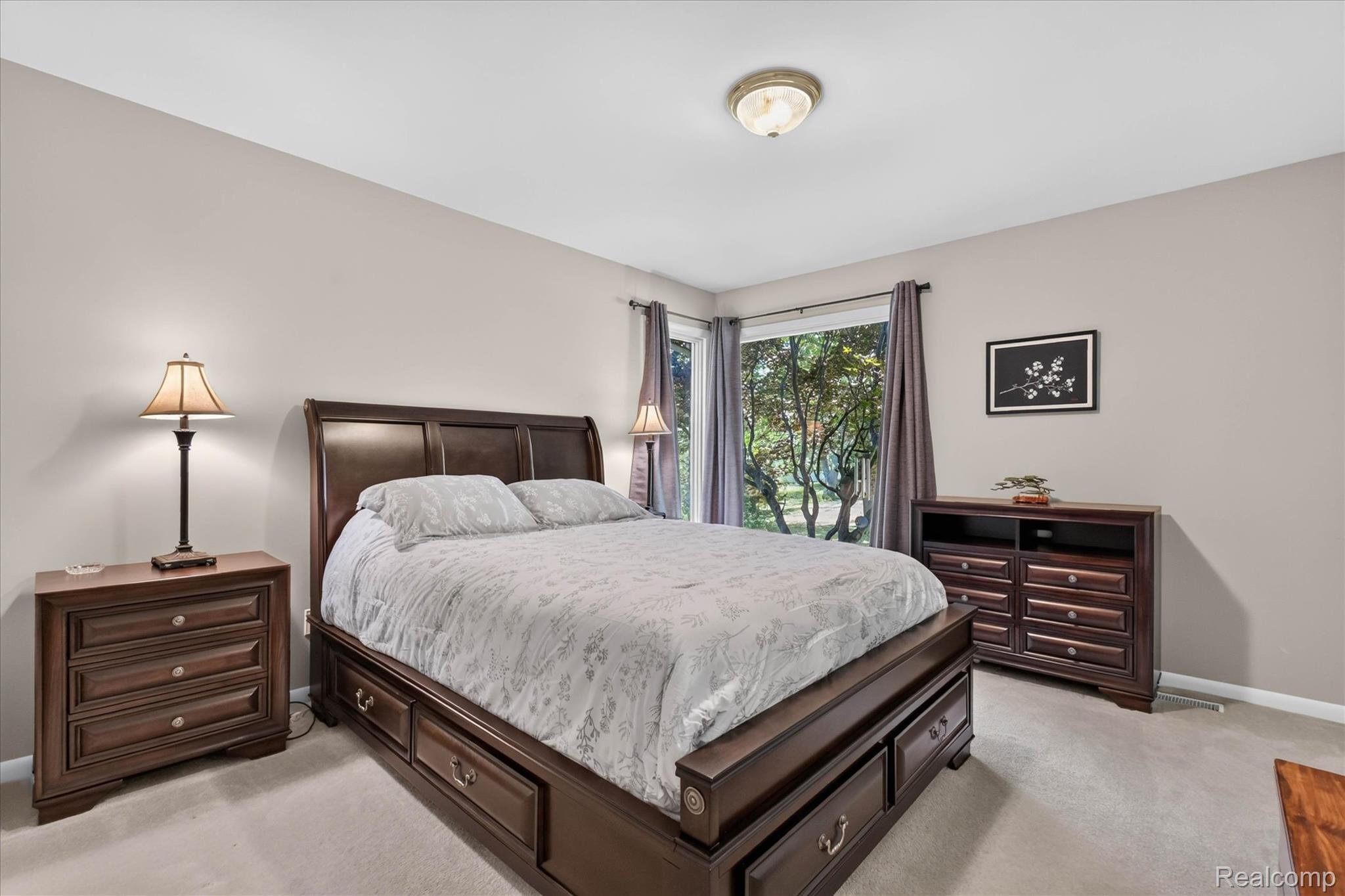 4037 Chilson Road Howell, MI 48843 - Photo 23 of 69 Wall-to-wall carpeting and a ceiling-mounted light fixture