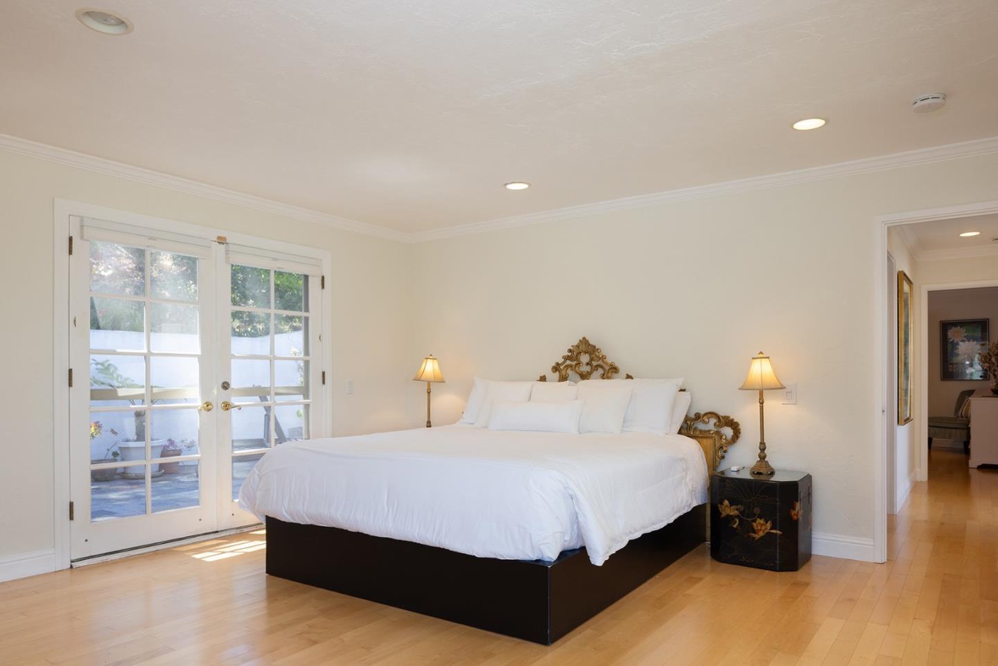 2920 Ribera Road Carmel, CA 93923 - Photo 11 of 18 a spacious bedroom with a bed and large window