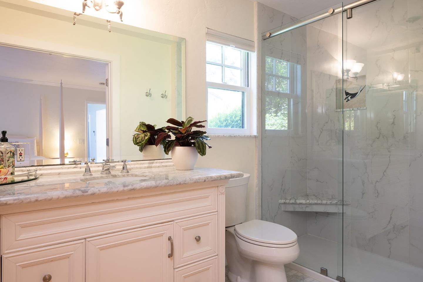 2920 Ribera Road Carmel, CA 93923 - Photo 14 of 18 a bathroom with a sink a toilet and a shower