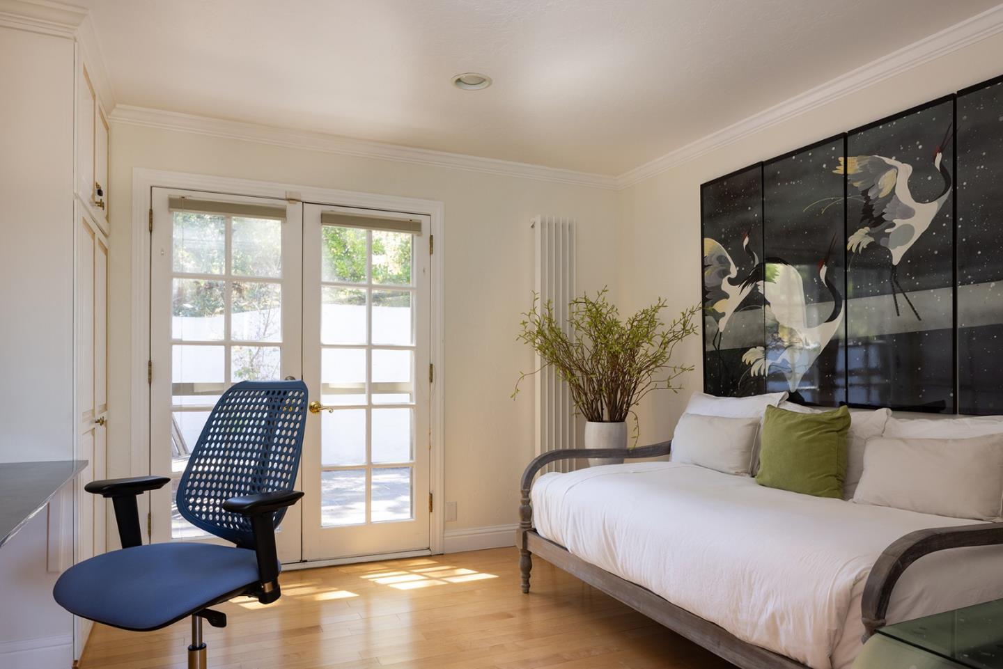 2920 Ribera Road Carmel, CA 93923 - Photo 15 of 18 a bedroom with a bed and a chair with the potted plant