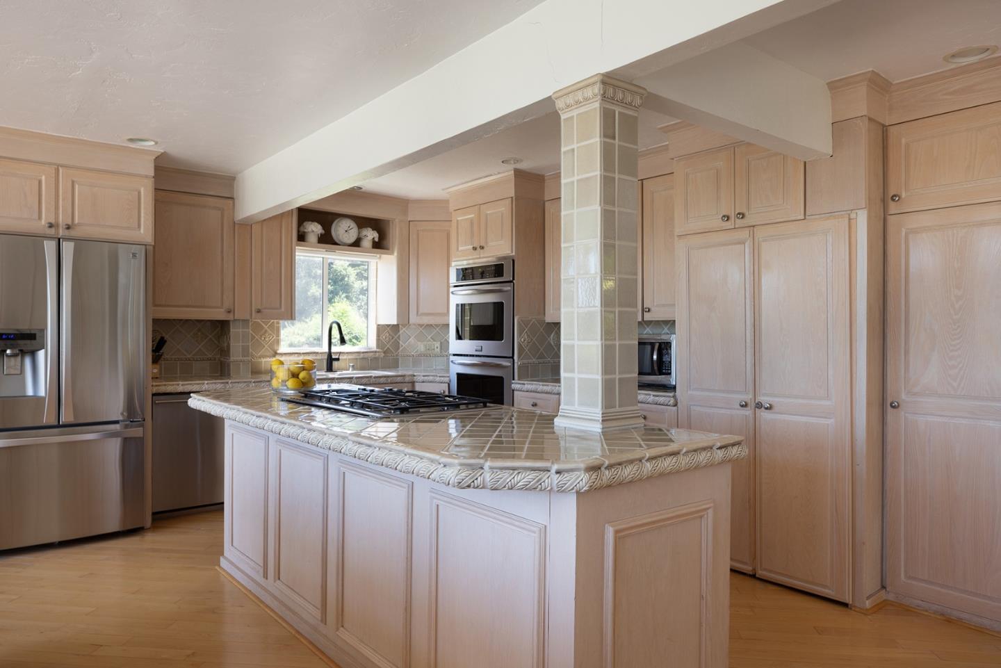 2920 Ribera Road Carmel, CA 93923 - Photo 6 of 18 a kitchen with stainless steel appliances granite countertop a refrigerator and a sink