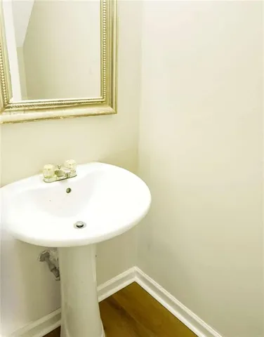 a bathroom with a sink and a window