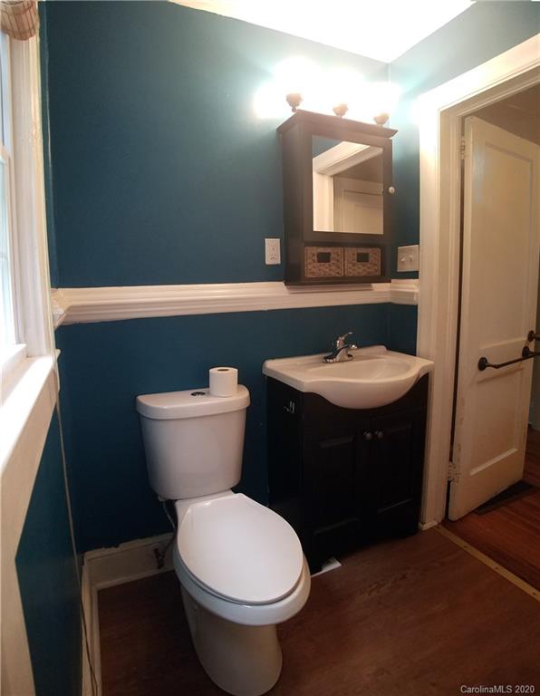 1900 Arnold Drive Charlotte, NC 28205 - Photo 12 of 23 a bathroom with a toilet sink and mirror