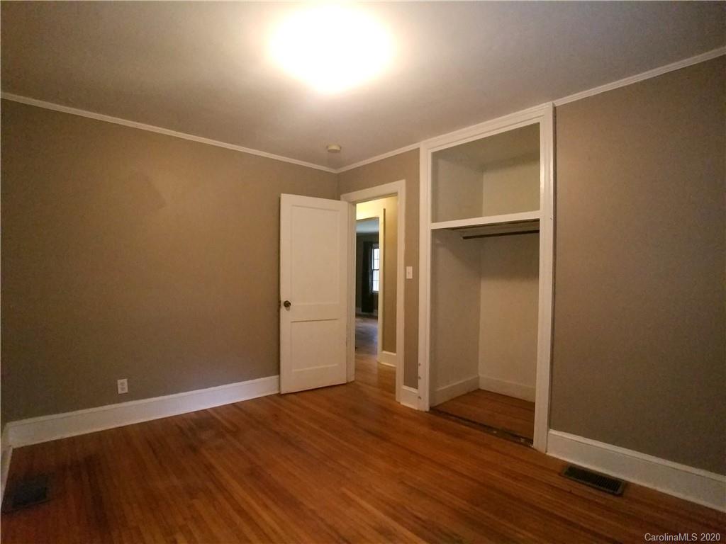 1900 Arnold Drive Charlotte, NC 28205 - Photo 14 of 23 a view of an empty room with wooden floor