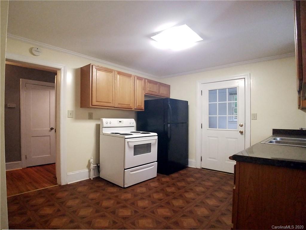 1900 Arnold Drive Charlotte, NC 28205 - Photo 19 of 23 a kitchen with a refrigerator stove and sink