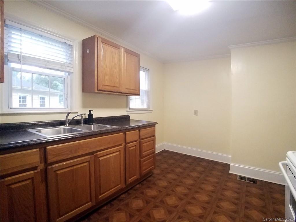 1900 Arnold Drive Charlotte, NC 28205 - Photo 20 of 23 a kitchen with sink and cabinets