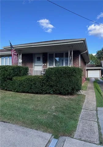 a front view of a house with yard