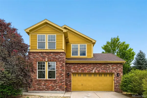 a front view of a house with yard