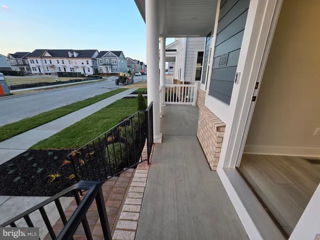 a view of a balcony and car parked
