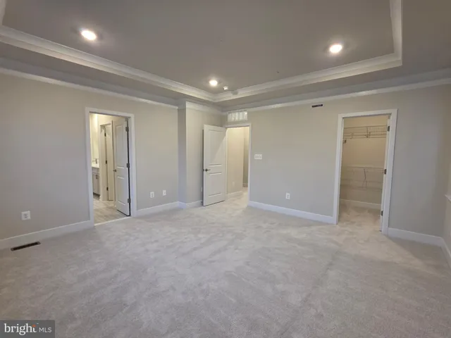 a view of hallway with wooden floor