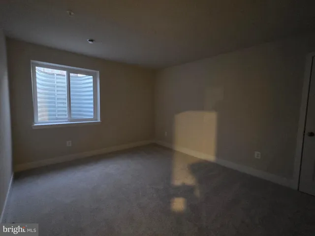 a bathroom with a sink a toilet a mirror a vanity and shower