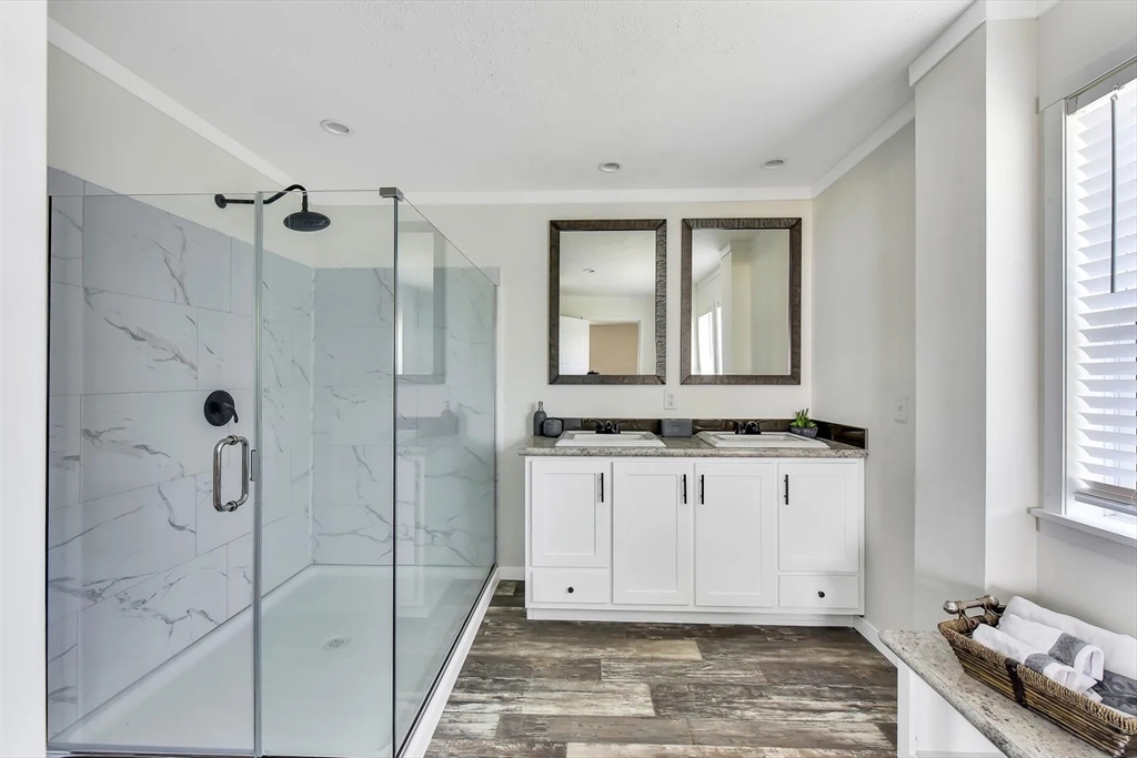 11 Annie's Way West Springfield, MA 01089 - Photo 9 of 18 a bathroom with a granite countertop sink a mirror and shower