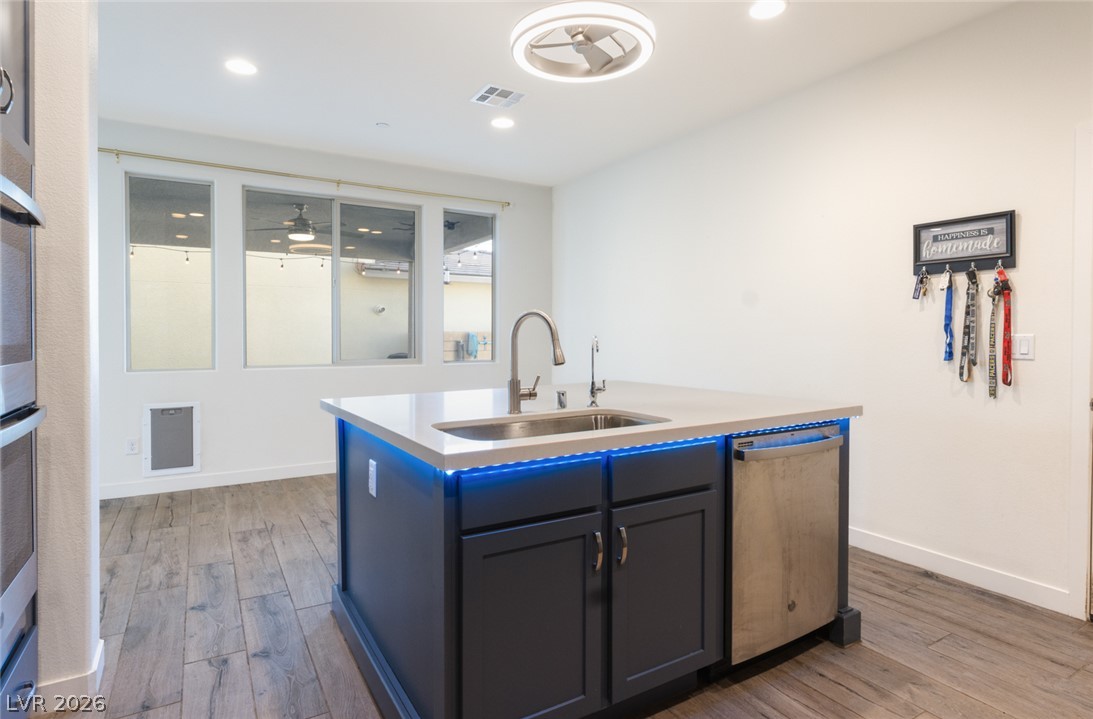 920 East Sunset Road Henderson, NV 89011 - Photo 10 of 33 Kitchen island offers both utility and modern design with integrated lighting. (removable if desired)