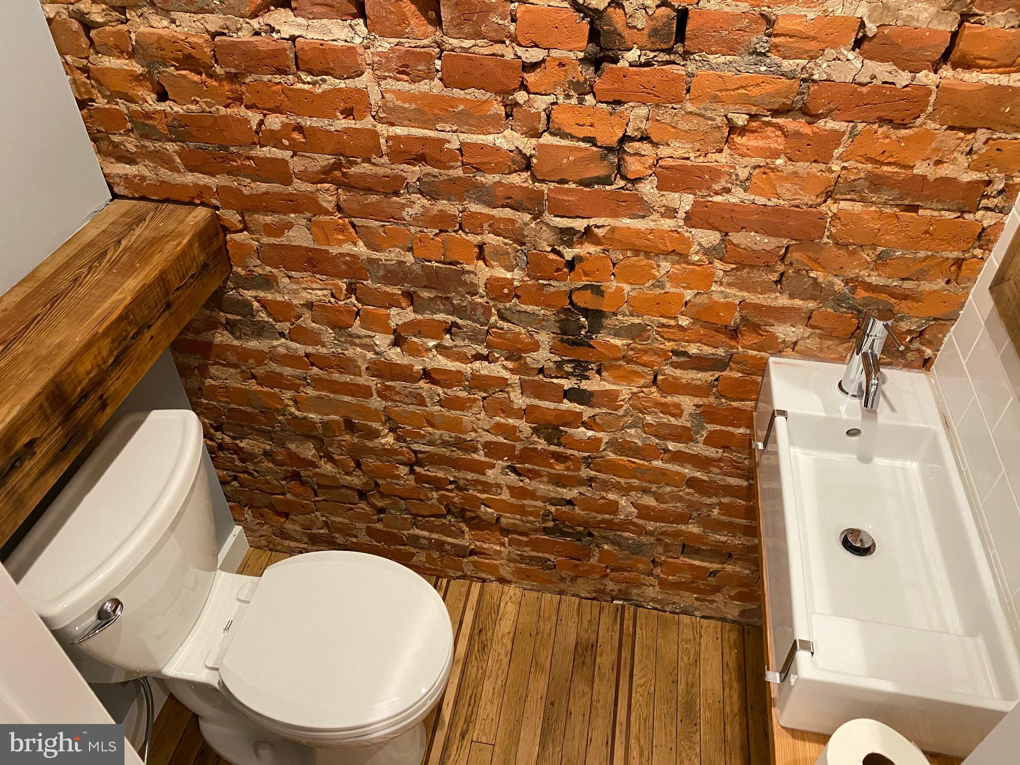 3229 Chatham Street Philadelphia, PA 19134 - Photo 20 of 41 a bathroom with a toilet and a shower curtain