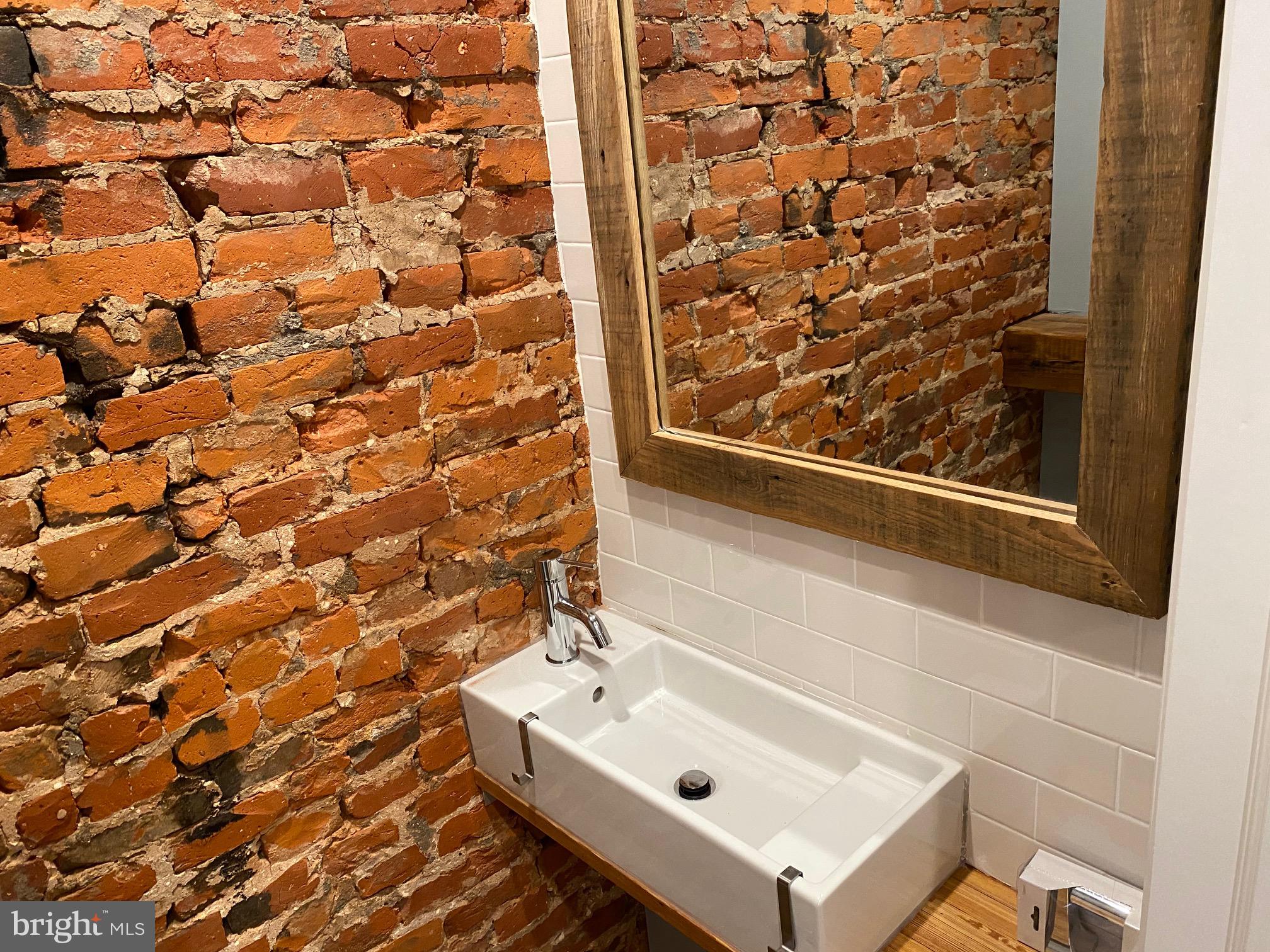 3229 Chatham Street Philadelphia, PA 19134 - Photo 21 of 41 a bathroom with a sink and a shower curtain