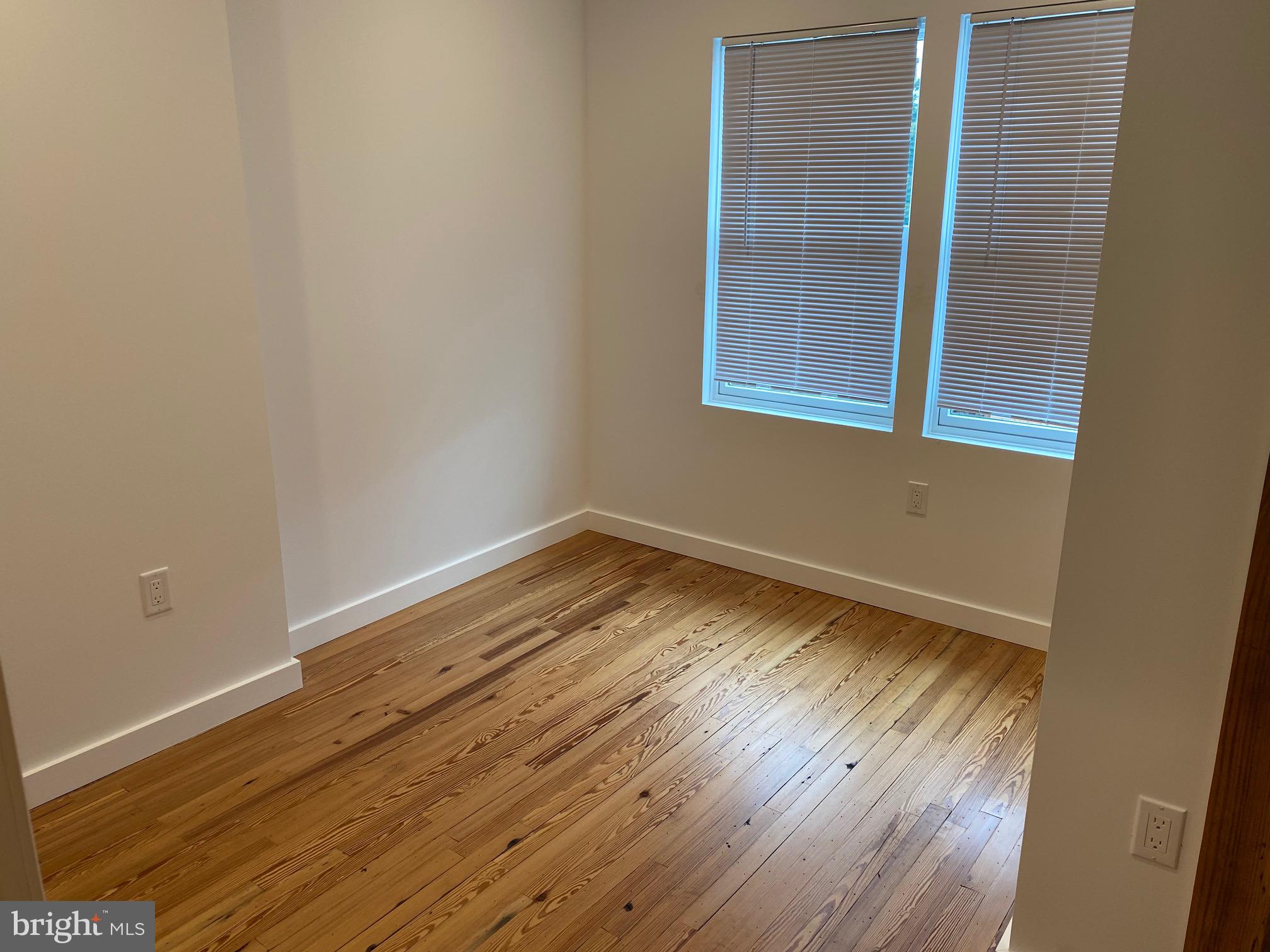 3229 Chatham Street Philadelphia, PA 19134 - Photo 26 of 41 a view of a room that has wooden floor and brick walls