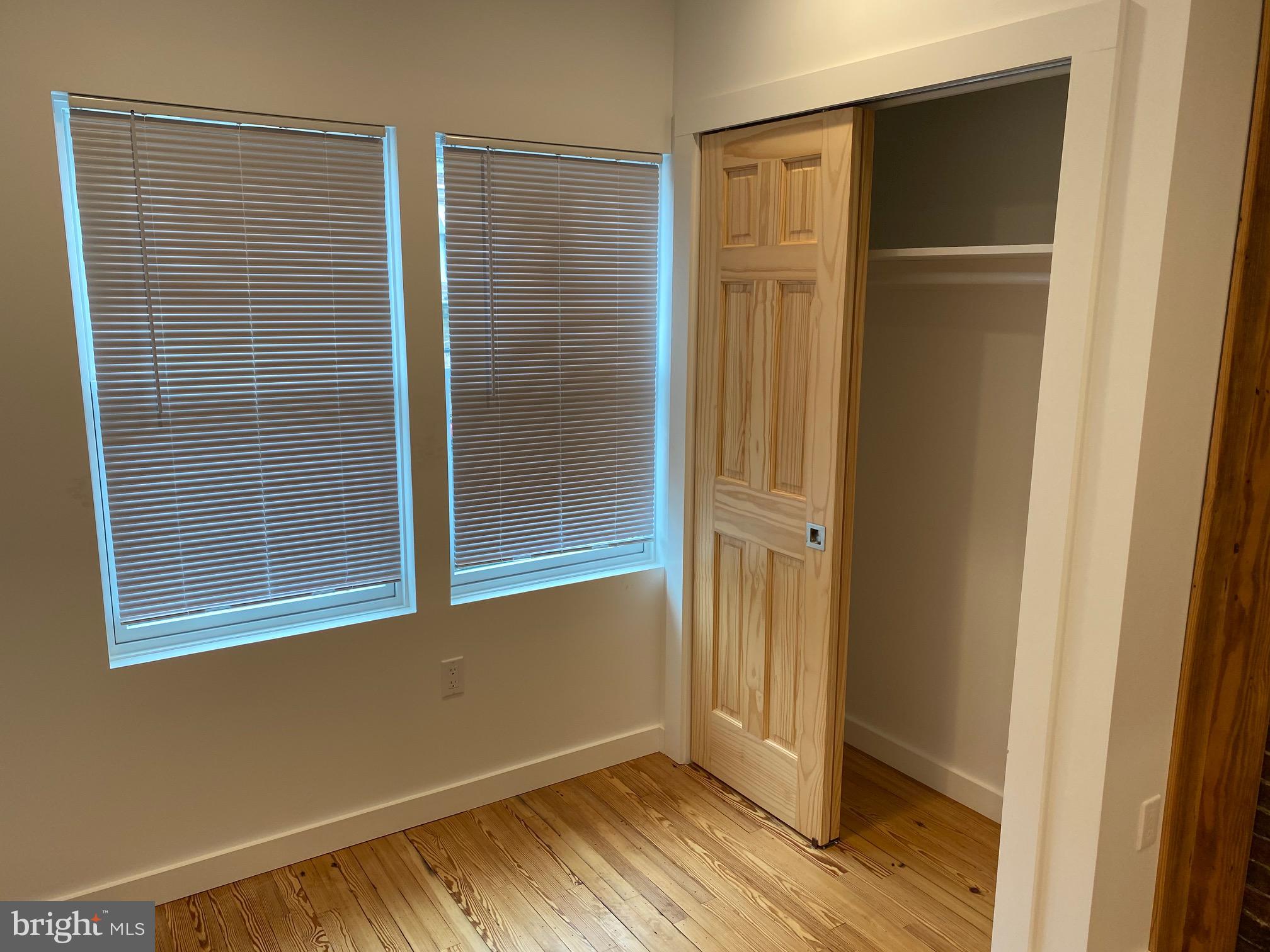 3229 Chatham Street Philadelphia, PA 19134 - Photo 27 of 41 a view of an empty room with wooden floor and a window
