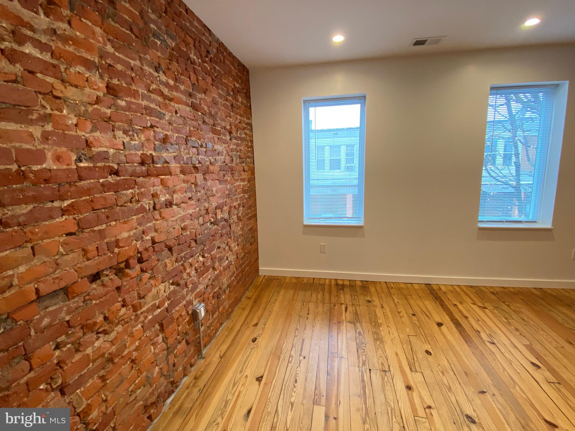 3229 Chatham Street Philadelphia, PA 19134 - Photo 30 of 41 an empty room with wooden floor and windows