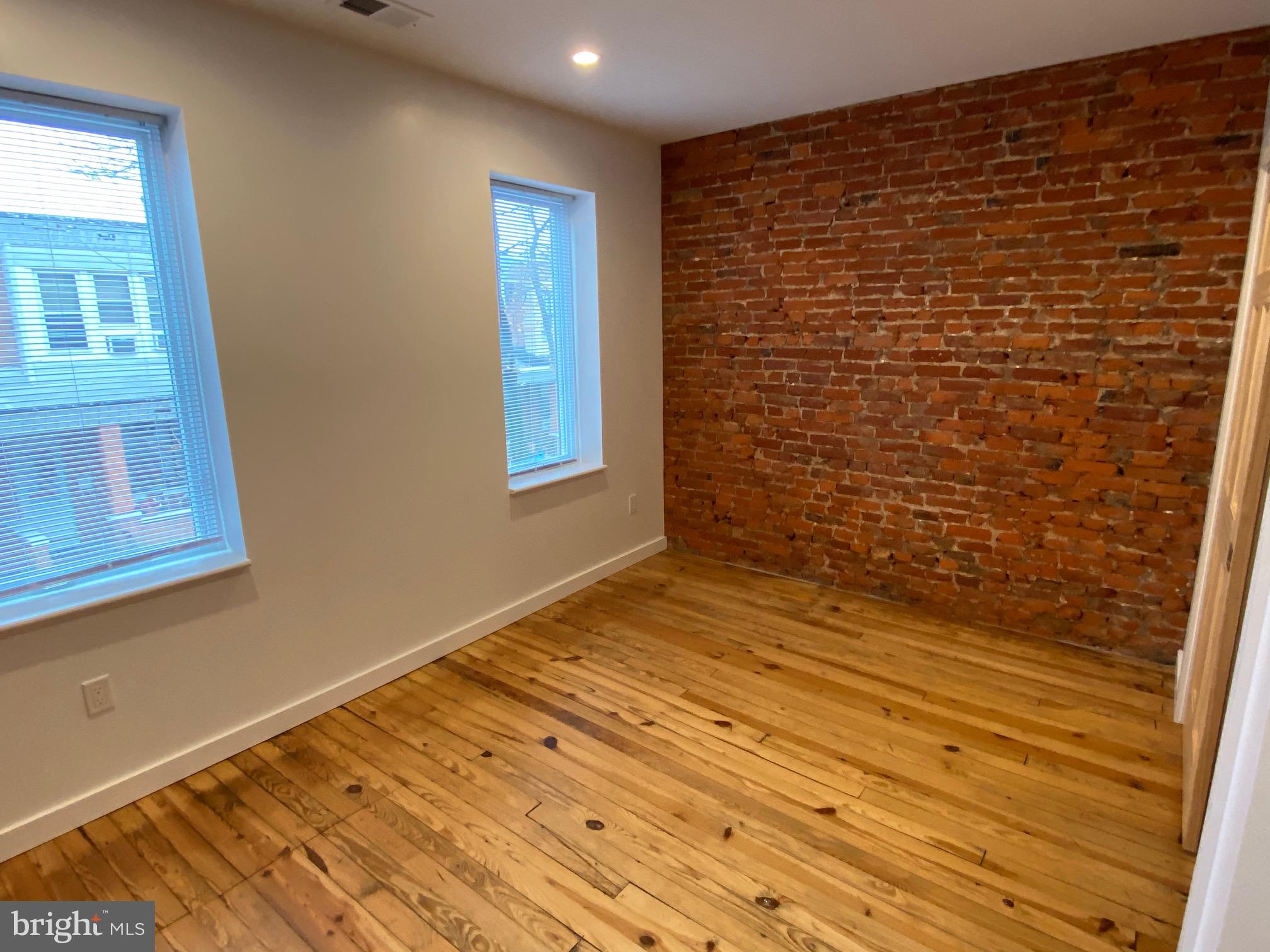 3229 Chatham Street Philadelphia, PA 19134 - Photo 31 of 41 a view of an empty room with wooden floor and a window