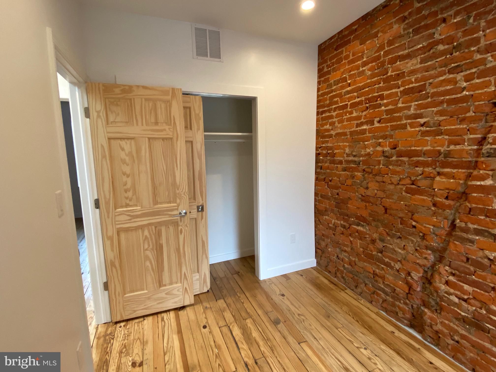 3229 Chatham Street Philadelphia, PA 19134 - Photo 38 of 41 a view of a hallway with wooden floor and closet area