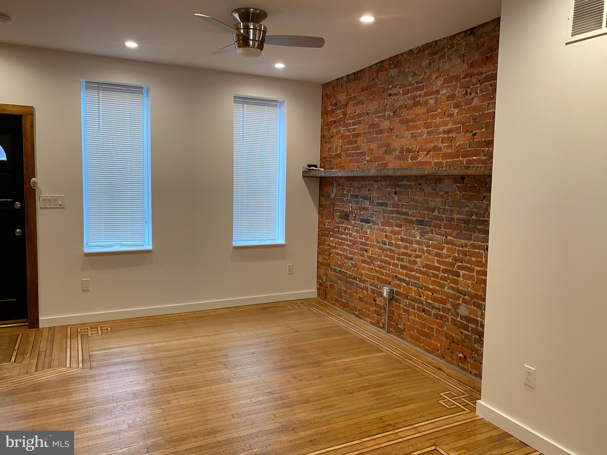 3229 Chatham Street Philadelphia, PA 19134 - Photo 4 of 41 a view of an empty room with wooden floor and a window