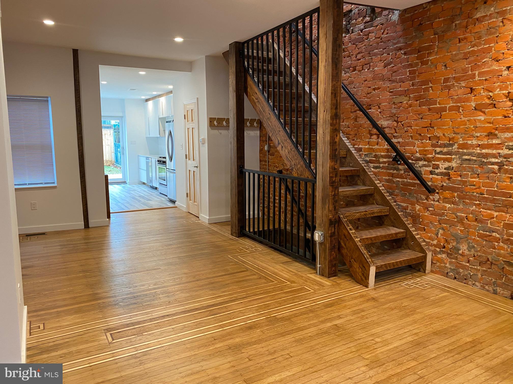 3229 Chatham Street Philadelphia, PA 19134 - Photo 9 of 41 a view of a hallway with wooden floor and staircase