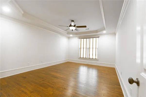 a bathroom with a granite countertop toilet and a sink
