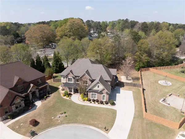 an aerial view of a house with swimming pool