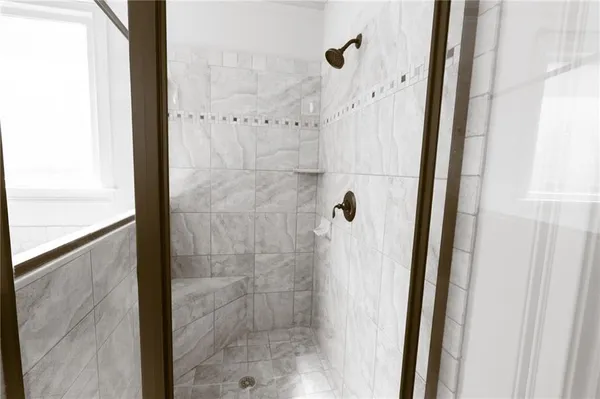 a living room with a fireplace cabinet and a fireplace