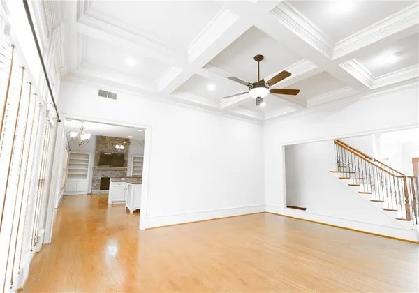 a view of a room with wooden floor