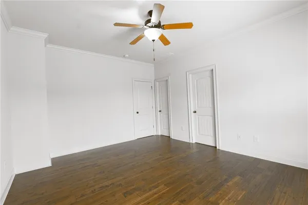 a living room with furniture ceiling fan and a rug