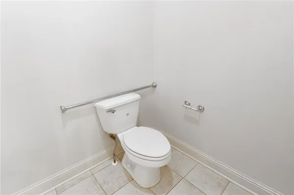 a bathroom with a shower and a sink mirror