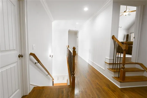 a view of an entryway with wooden floor