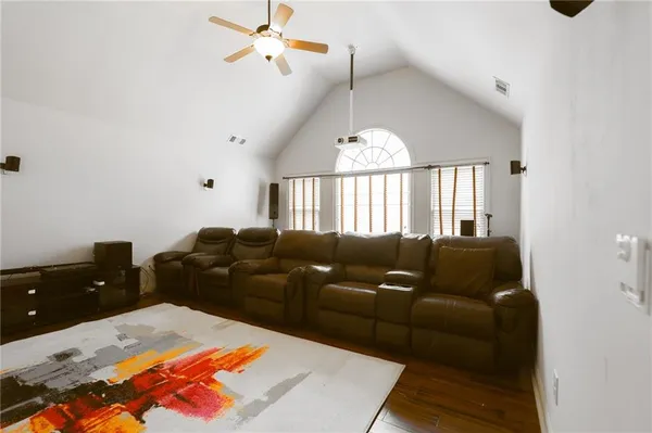 a view of a livingroom with a fireplace and window