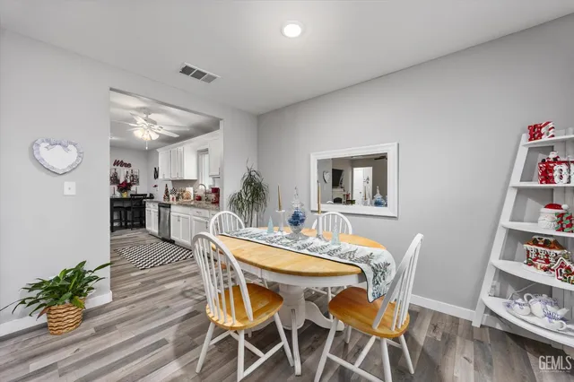 a view of a dining room with furniture and wooden floor
