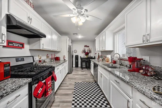 a kitchen with lots of counter space and a sink