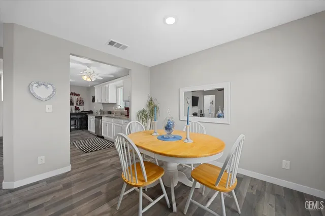 a dining room with furniture and window