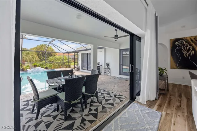 a view of a dining room with furniture window and wooden floor
