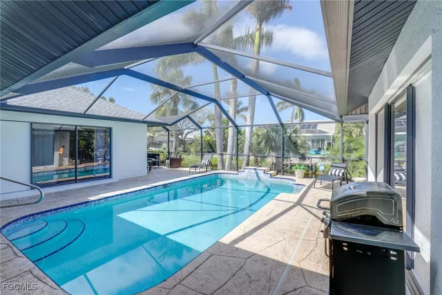 a view of swimming pool with outdoor seating
