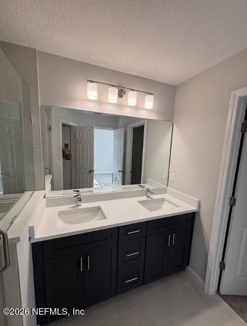 1301 Jewelstone Lane Jacksonville, FL 32221 - Photo 11 of 15 a bathroom with a sink double vanity and a mirror