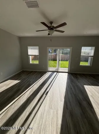 a view of an empty room with a window
